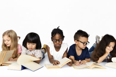 Group of multicultural students motivated to read independently.