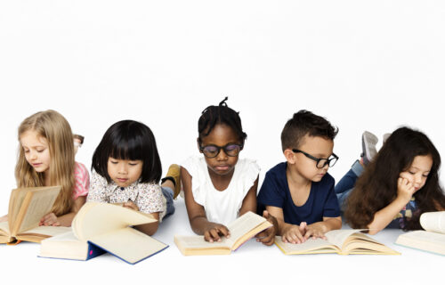 Group of multicultural students motivated to read independently.