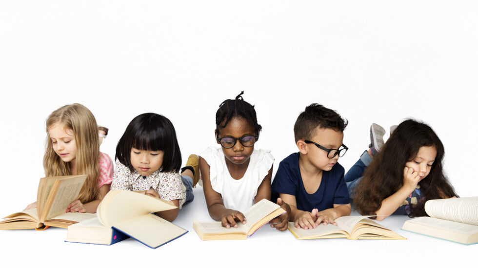 Group of multicultural students motivated to read independently.