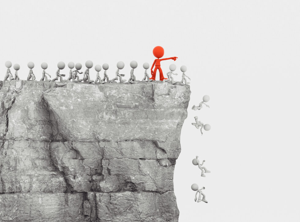 Red leader pointing small white figures off a cliff illustrates that following literacy trends can lead to confusion and ineffective results.